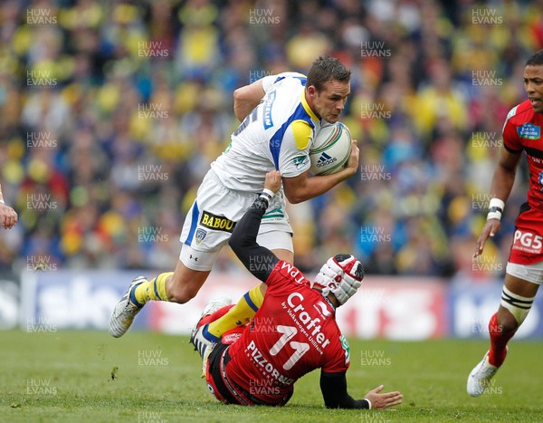 180513 - ASM Clermont Auvergne v Toulon - Heineken Cup Final - Lee Byrne of Clermont is tackled by Alexis Palisson of Toulon 