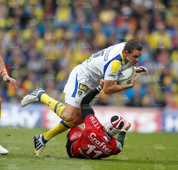 180513 - ASM Clermont Auvergne v Toulon - Heineken Cup Final - Lee Byrne of Clermont is tackled by Alexis Palisson of Toulon 