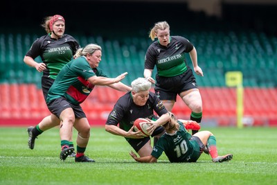 180426 - Clwb Rygbi Cymry Caerdydd v Seven Sisters - WRU Women's National Plate - Bethan Howell of Seven Sisters is tackled by Alaw Hughes of Clwb Rygbi Cymry Caerdydd