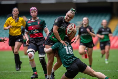180426 - Clwb Rygbi Cymry Caerdydd v Seven Sisters - WRU Women's National Plate - Heeled Lewis of Seven Sisters is tackled by Morgan Hodgkins of Clwb Rygbi Cymry Caerdydd