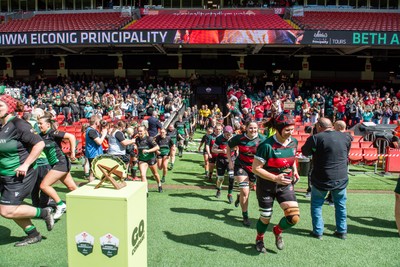 180426 - Clwb Rygbi Cymry Caerdydd v Seven Sisters - WRU Women's National Plate - Players run on to the pitch past the trophy