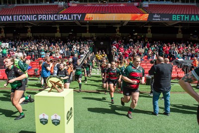 180426 - Clwb Rygbi Cymry Caerdydd v Seven Sisters - WRU Women's National Plate - Players run on to the pitch past the trophy
