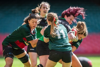 180426 - Clwb Rygbi Cymry Caerdydd v Seven Sisters - WRU Women's National Plate - Rachel Rees of Seven Sisters is tackled by Cara Ottaway of Clwb Rygbi Cymry Caerdydd