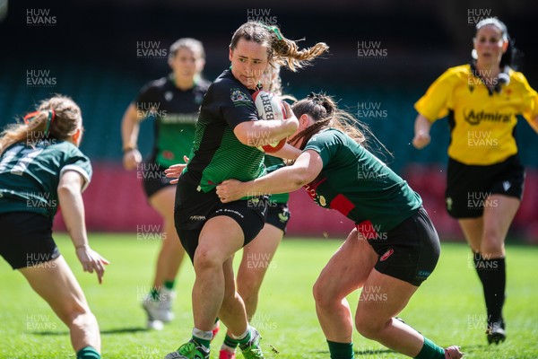 180426 - Clwb Rygbi Cymry Caerdydd v Seven Sisters - WRU Women's National Plate - Melissa Gnojek of Seven Sisters is tackled by Rhi Gower of Clwb Rygbi Cymry Caerdydd