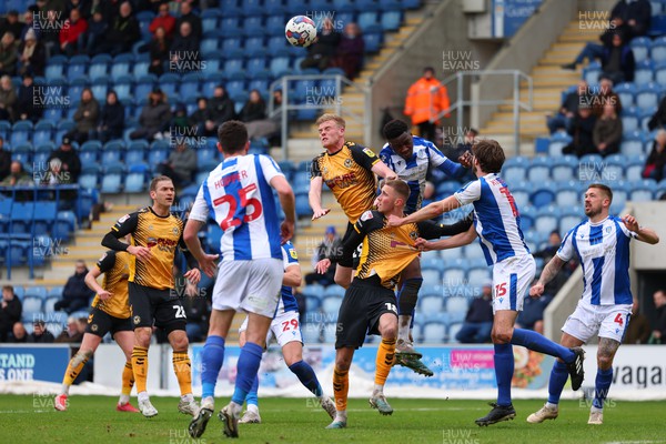 010423 - Colchester United v Newport County - Sky Bet League 2 - Will Evans of Newport County competes for the ball with Junior Tchamadeu of Colchester United