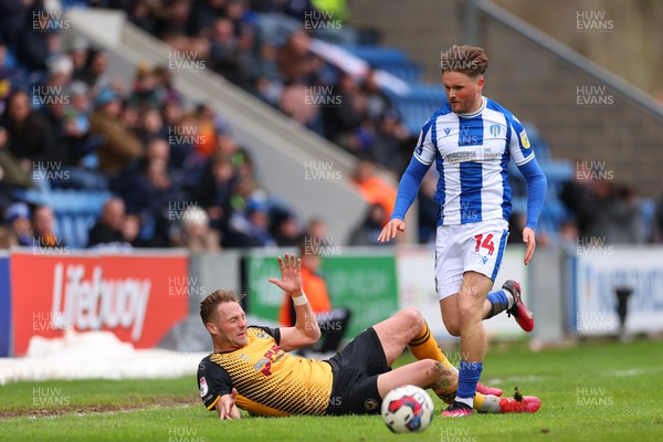 010423 - Colchester United v Newport County - Sky Bet League 2 - Noah Chilvers of Colchester United fouls Cameron Norman of Newport County