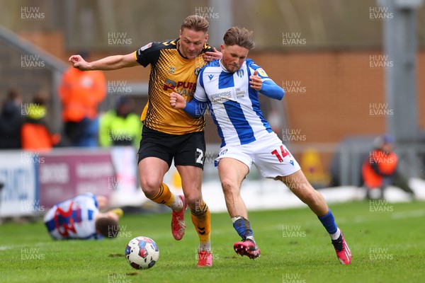 010423 - Colchester United v Newport County - Sky Bet League 2 - Noah Chilvers of Colchester United fouls Cameron Norman of Newport County