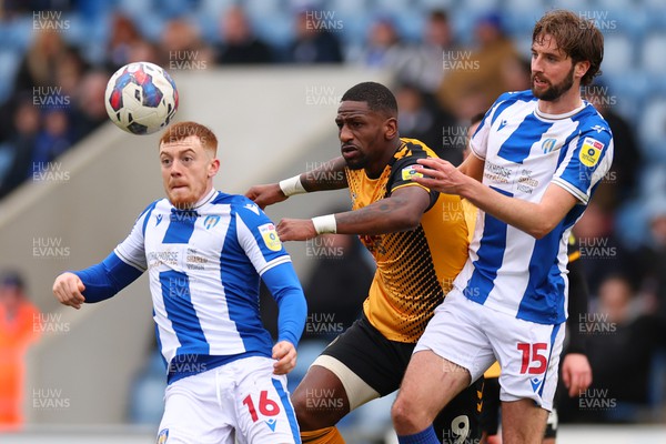 010423 - Colchester United v Newport County - Sky Bet League 2 - Omar Bogle of Newport County is man marked by Arthur Read and Fiacre Kelleher of Colchester United