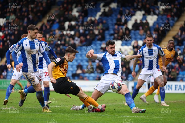 010423 - Colchester United v Newport County - Sky Bet League 2 - Charlie McNeill of Newport County shot is blocked by Connor Hall of Colchester United