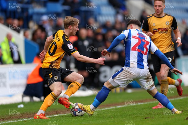 010423 - Colchester United v Newport County - Sky Bet League 2 - Harry Charsley of Newport County takes on Connor Wood of Colchester United