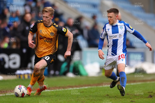 010423 - Colchester United v Newport County - Sky Bet League 2 - Harry Charsley of Newport County takes on Matt Jay of Colchester United