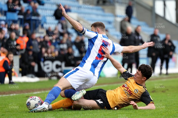 010423 - Colchester United v Newport County - Sky Bet League 2 - Calum Kavanagh of Newport County fouls Tommy Smith of Colchester United