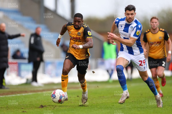 010423 - Colchester United v Newport County - Sky Bet League 2 - Cameron Norman of Newport County takes on Connor Hall of Colchester United