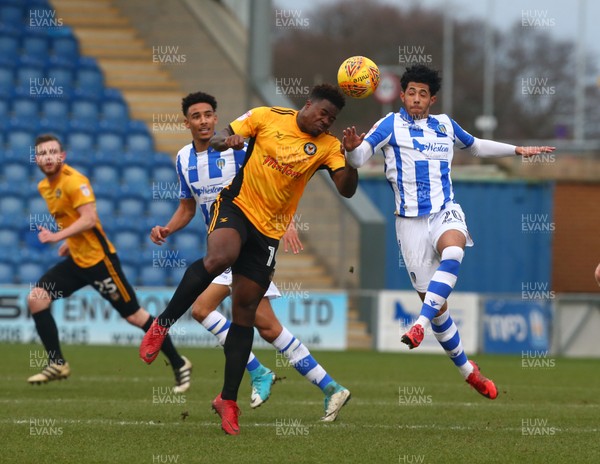 030218 - Colchester United v Newport County - Sky Bet League Two - Frank Nouble of Newport County AFC beats Colchester United's Kane Vincent-Young 