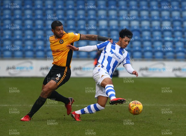 030218 - Colchester United v Newport County - Sky Bet League Two -  Colchester United's Kane Vincent-Young beats Joss Labadie of Newport County AFC