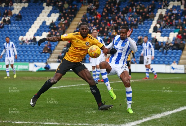 030218 - Colchester United v Newport County - Sky Bet League Two - Frank Nouble of Newport County AFC beats Colchester United's Kane Vincent Young 