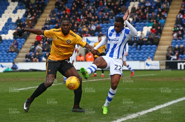 030218 - Colchester United v Newport County - Sky Bet League Two - Frank Nouble of Newport County AFC beats Colchester United's Kane Vincent Young 
