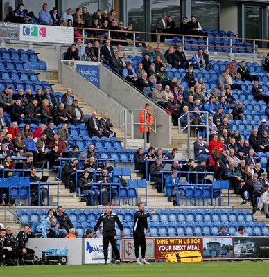 081016 - Colchester United vs Newport County  - SkyBet EFL League 2 -Sean Mccarthy of Newport with Graham Westley in the back row watching from up high