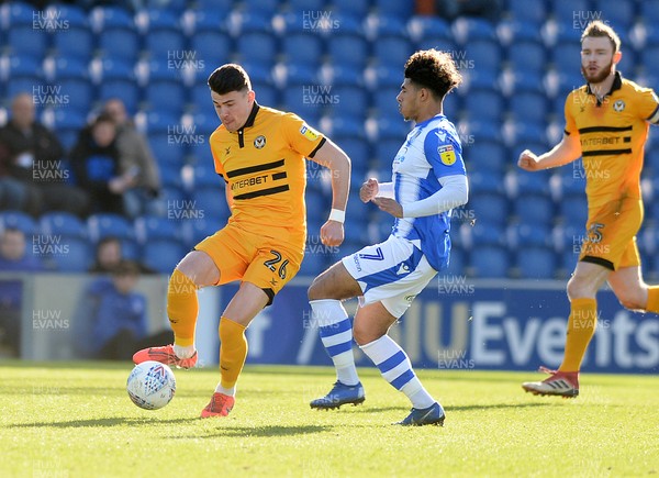 090319 - Colchester United v Newport County - Sky Bet League 2 -  Newports Regan Poole clears from Courtney Senior of Colchester