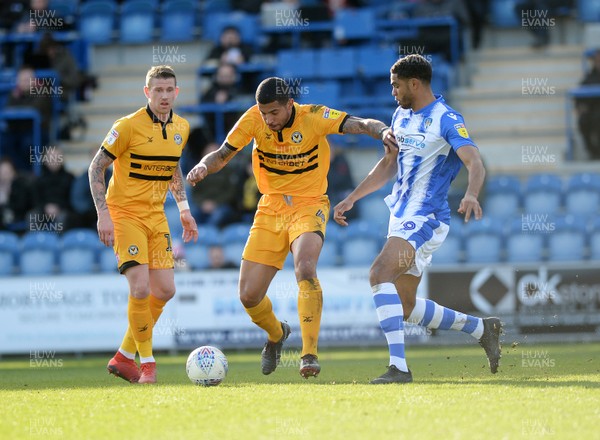 090319 - Colchester United v Newport County - Sky Bet League 2 -  Newports Joss Labadie with Colchesters Mikael Mandron