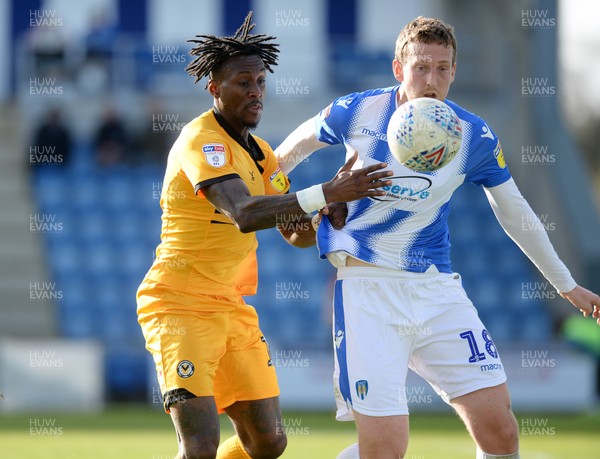 090319 - Colchester United v Newport County - Sky Bet League 2 -  Newports Ade Azeez with Colchesters Tom Eastman
