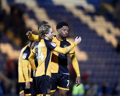 201225 - Colchester United v Newport County - Sky Bet League 2 - Bobby Kamwa and Sammy Braybrooke of Newport County embrace after the final whistle