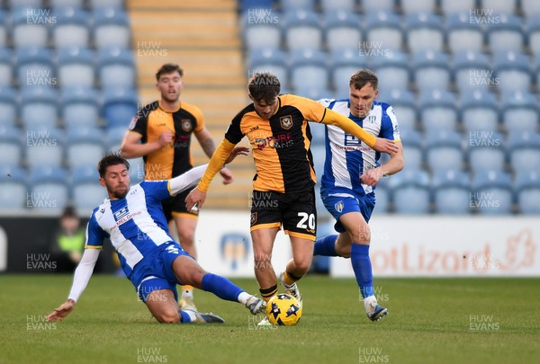 201225 - Colchester United v Newport County - Sky Bet League 2 - Ben Lloyd of Newport County battles with Ellis Iandolo of Colchester United