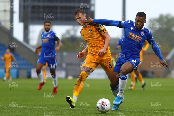 261019 - Colchester United v Newport County - Sky Bet League 2 -  Ryan Jackson of Colchester United holds off George Nurse of Newport County 