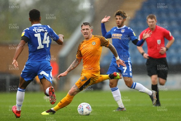 261019 - Colchester United v Newport County - Sky Bet League 2 -  Scot Bennett of Newport County gets between Brandon Comley and Courtney Senior of Colchester United