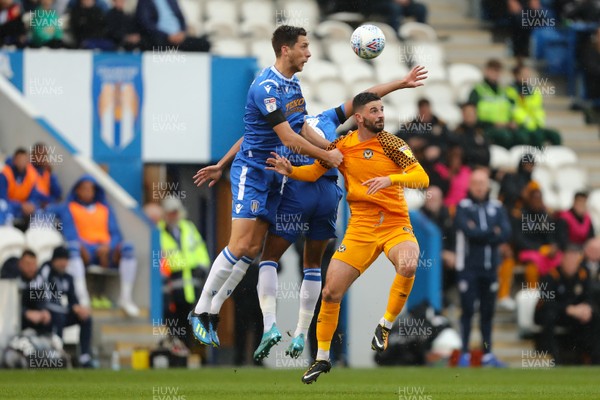 261019 - Colchester United v Newport County - Sky Bet League 2 -  Padraig Amond of Newport County battles with Luke Prosser of Colchester United 