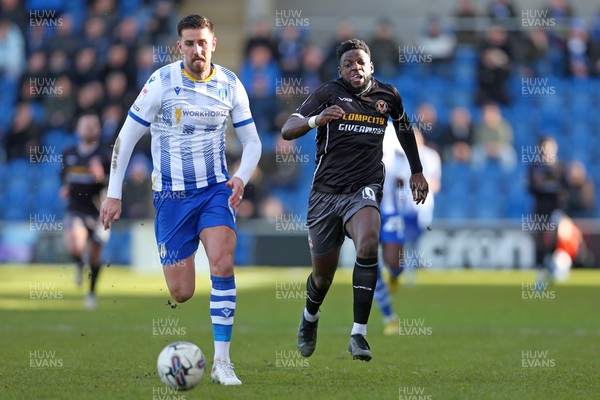 290324 - Colchester United v Newport County - Sky Bet League 2 - Offrande Zanzala of Newport County chasing for the ball