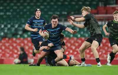 101225 - Coleg Cymoedd v Ysgol Gyfun Gymraeg Glantaf, Welsh Schools and Colleges Boys U18 Final - Efan Jenkins of Ysgol Gymraeg Glantaf is tackled