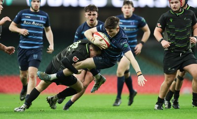 101225 - Coleg Cymoedd v Ysgol Gyfun Gymraeg Glantaf, Welsh Schools and Colleges Boys U18 Final - Evan Jones of Ysgol Gymraeg Glantaf is tackled by Ben Coomer of Coleg y Cymoedd