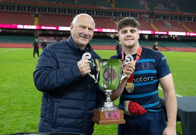 101225 - Coleg Cymoedd v Ysgol Gyfun Gymraeg Glantaf, Welsh Schools and Colleges Boys U18 Final -  WRU President Terry Cobner presents Alfie Prygodzicz Captain of Ysgol Gymraeg Glantaf with the trophy