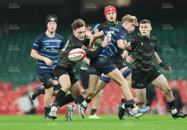 101225 - Coleg Cymoedd v Ysgol Gyfun Gymraeg Glantaf, Welsh Schools and Colleges Boys U18 Final - Ben Coomer of Coleg y Cymoedd and Finn Evans of Ysgol Gymraeg Glantaf compete for the ball
