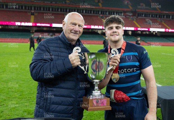 101225 - Coleg Cymoedd v Ysgol Gyfun Gymraeg Glantaf, Welsh Schools and Colleges Boys U18 Final -  WRU President Terry Cobner presents Alfie Prygodzicz Captain of Ysgol Gymraeg Glantaf with the trophy