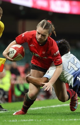 101225 - Coleg Gwent v Llandovery College Welsh Schools and Colleges Girls U18 Final - Ruby Cole of Coleg Gwent is tackled just short of the line by Zillah Radrodro of Llandovery College