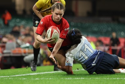 101225 - Coleg Gwent v Llandovery College Welsh Schools and Colleges Girls U18 Final - Ruby Cole of Coleg Gwent is tackled just short of the line by Zillah Radrodro of Llandovery College