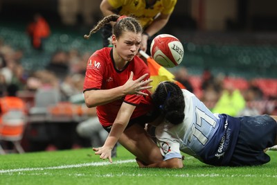 101225 - Coleg Gwent v Llandovery College Welsh Schools and Colleges Girls U18 Final - Ruby Cole of Coleg Gwent is tackled just short of the line by Zillah Radrodro of Llandovery College