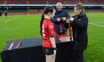 101225 - Coleg Gwent v Llandovery College Welsh Schools and Colleges Girls U18 Final - Wales International Kerin Lake presents the winners medals to Coleg Gwent