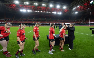 101225 - Coleg Gwent v Llandovery College Welsh Schools and Colleges Girls U18 Final - Wales International Kerin Lake presents the winners medals to Coleg Gwent