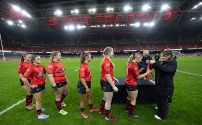 101225 - Coleg Gwent v Llandovery College Welsh Schools and Colleges Girls U18 Final - Wales International Kerin Lake presents the winners medals to Coleg Gwent