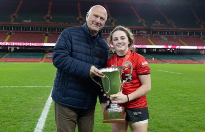 101225 - Coleg Gwent v Llandovery College Welsh Schools and Colleges Girls U18 Final - WRU President Terry Cobner presents the trophy to Coleg Gwent captain Lily Hawkins