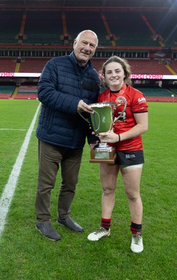101225 - Coleg Gwent v Llandovery College Welsh Schools and Colleges Girls U18 Final - WRU President Terry Cobner presents the trophy to Coleg Gwent captain Lily Hawkins