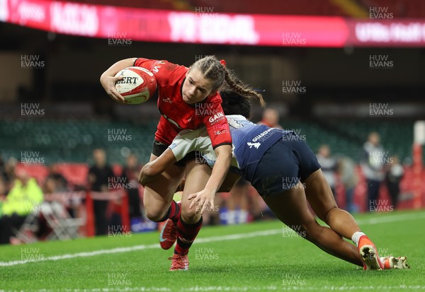 101225 - Coleg Gwent v Llandovery College Welsh Schools and Colleges Girls U18 Final - Ruby Cole of Coleg Gwent is tackled just short of the line by Zillah Radrodro of Llandovery College