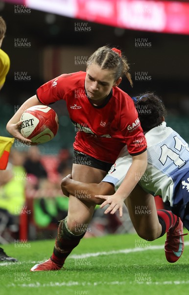 101225 - Coleg Gwent v Llandovery College Welsh Schools and Colleges Girls U18 Final - Ruby Cole of Coleg Gwent is tackled just short of the line by Zillah Radrodro of Llandovery College
