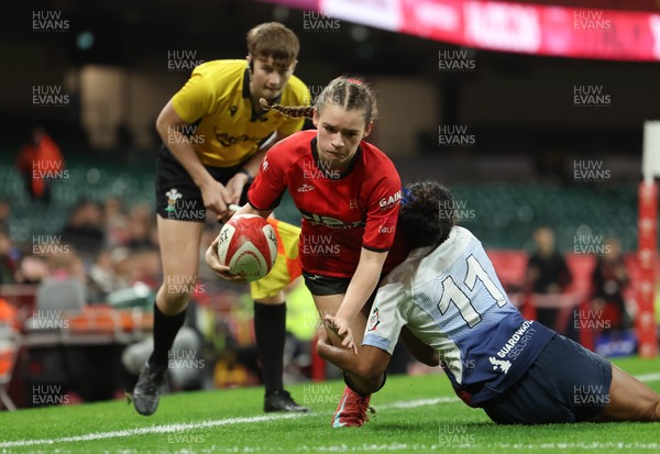 101225 - Coleg Gwent v Llandovery College Welsh Schools and Colleges Girls U18 Final - Ruby Cole of Coleg Gwent is tackled just short of the line by Zillah Radrodro of Llandovery College