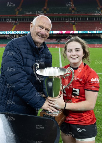 101225 - Coleg Gwent v Llandovery College Welsh Schools and Colleges Girls U18 Final - WRU President Terry Cobner presents the trophy to Coleg Gwent captain Lily Hawkins