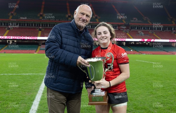 101225 - Coleg Gwent v Llandovery College Welsh Schools and Colleges Girls U18 Final - WRU President Terry Cobner presents the trophy to Coleg Gwent captain Lily Hawkins