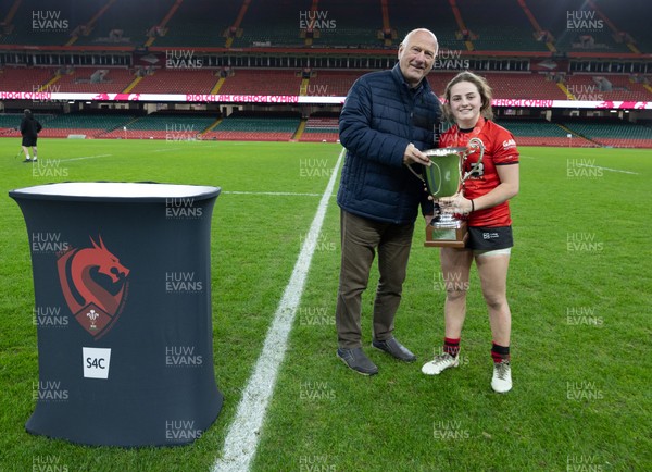 101225 - Coleg Gwent v Llandovery College Welsh Schools and Colleges Girls U18 Final - WRU President Terry Cobner presents the trophy to Coleg Gwent captain Lily Hawkins
